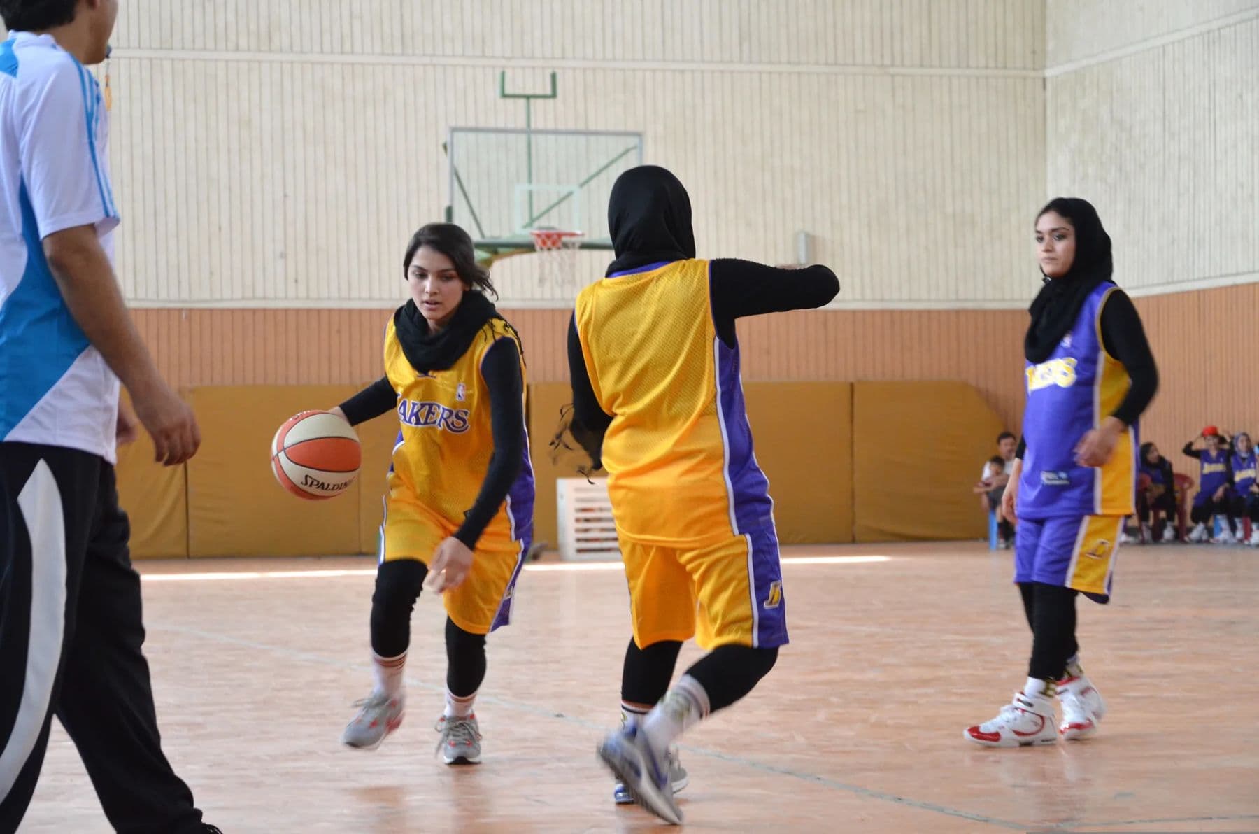 Basketball players on an indoor court