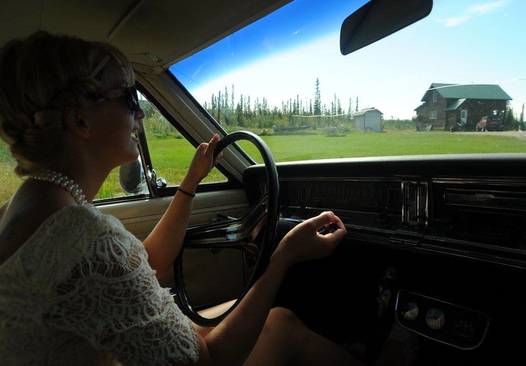 Driver at the wheel seen from the passenger seat