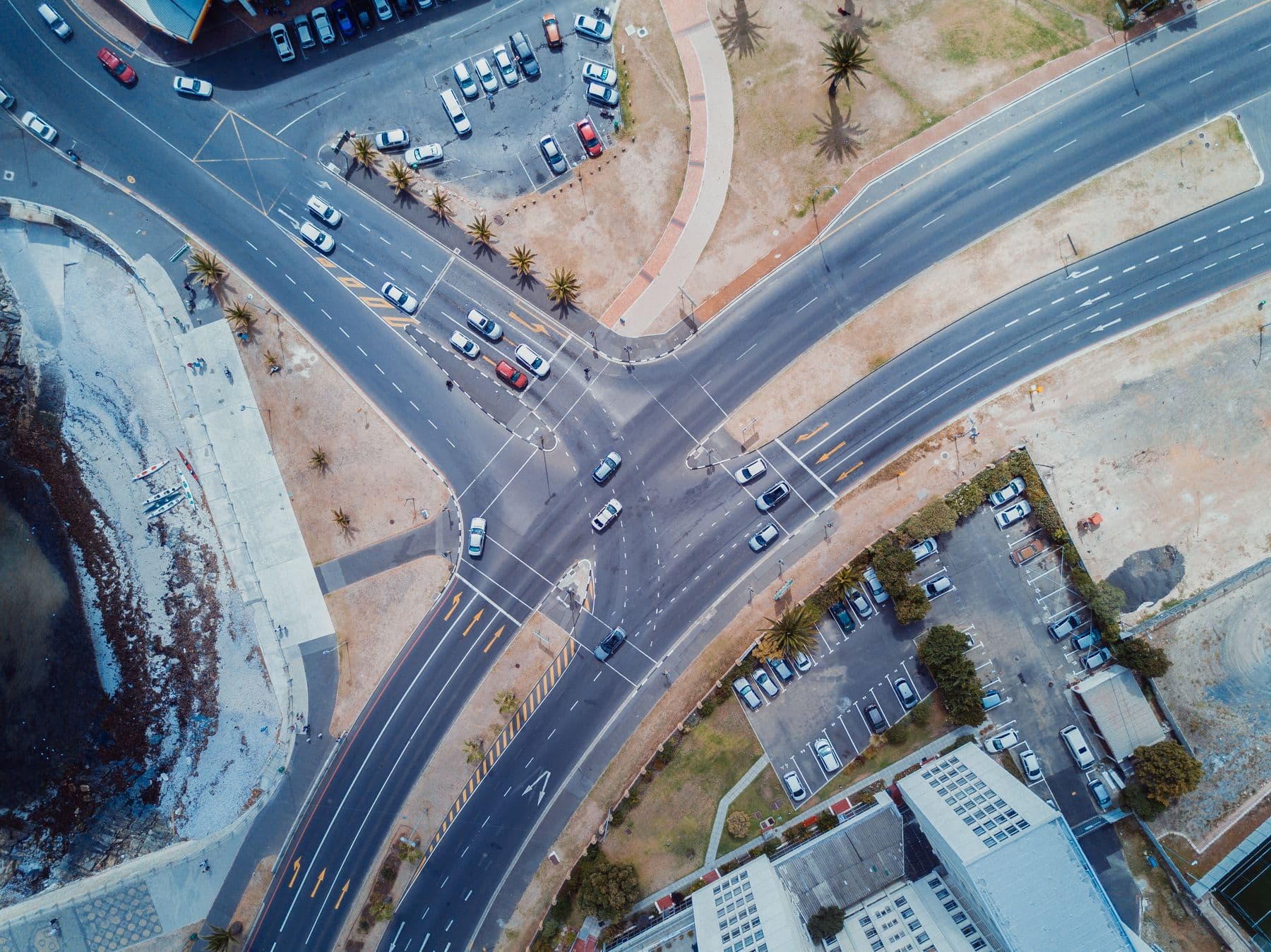 Drone view of a road junction with traffic