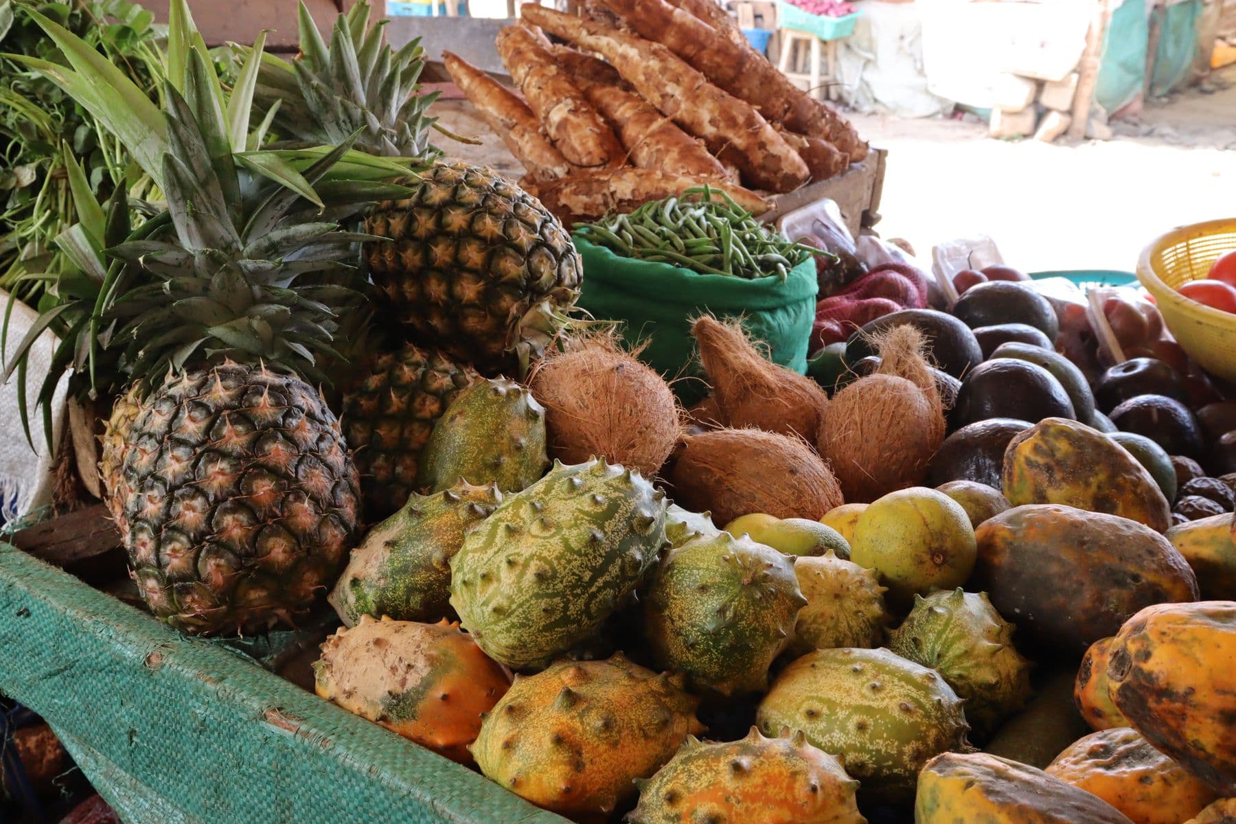Tropical fruit stacked at a market stall