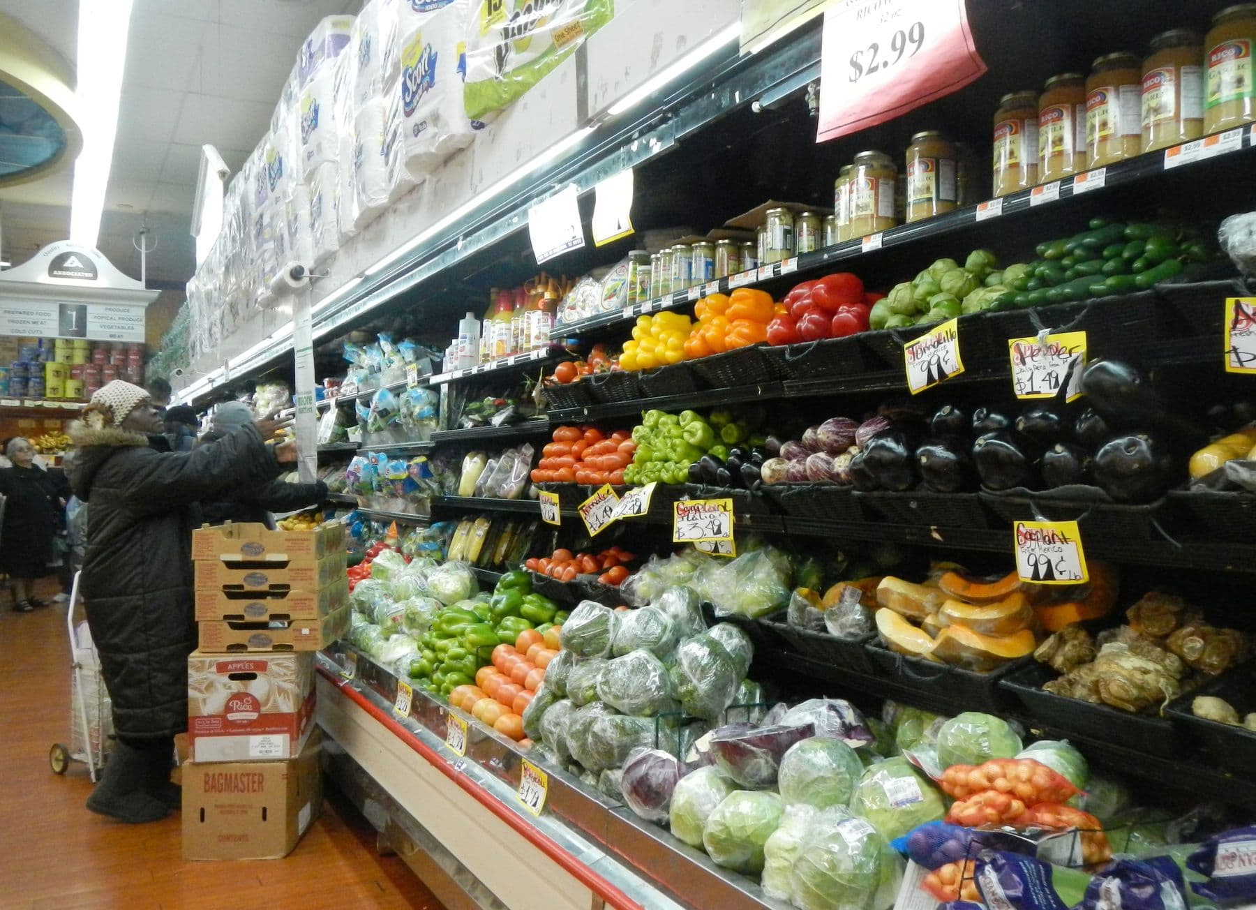 Supermarket produce aisle with fruit and vegetables
