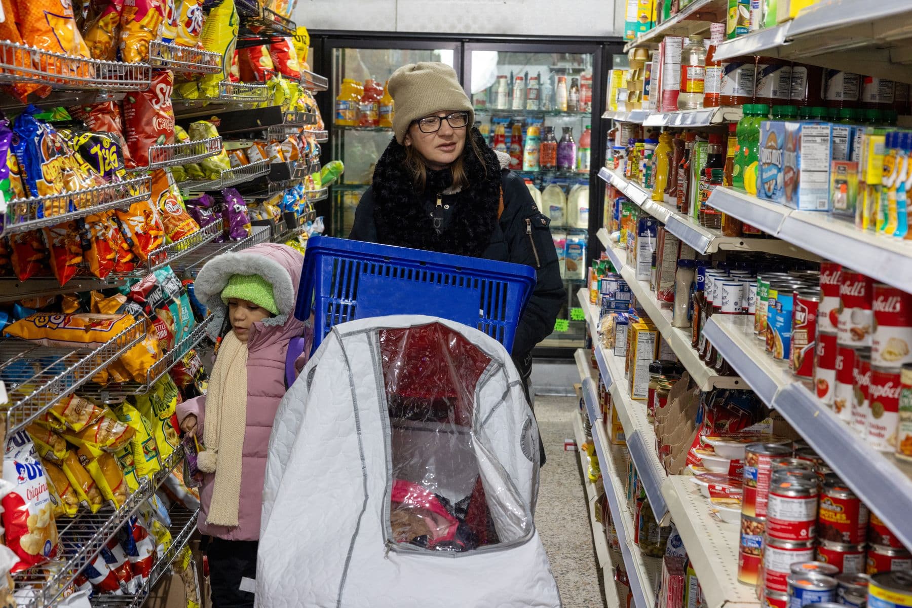 Shopper walking down a grocery aisle