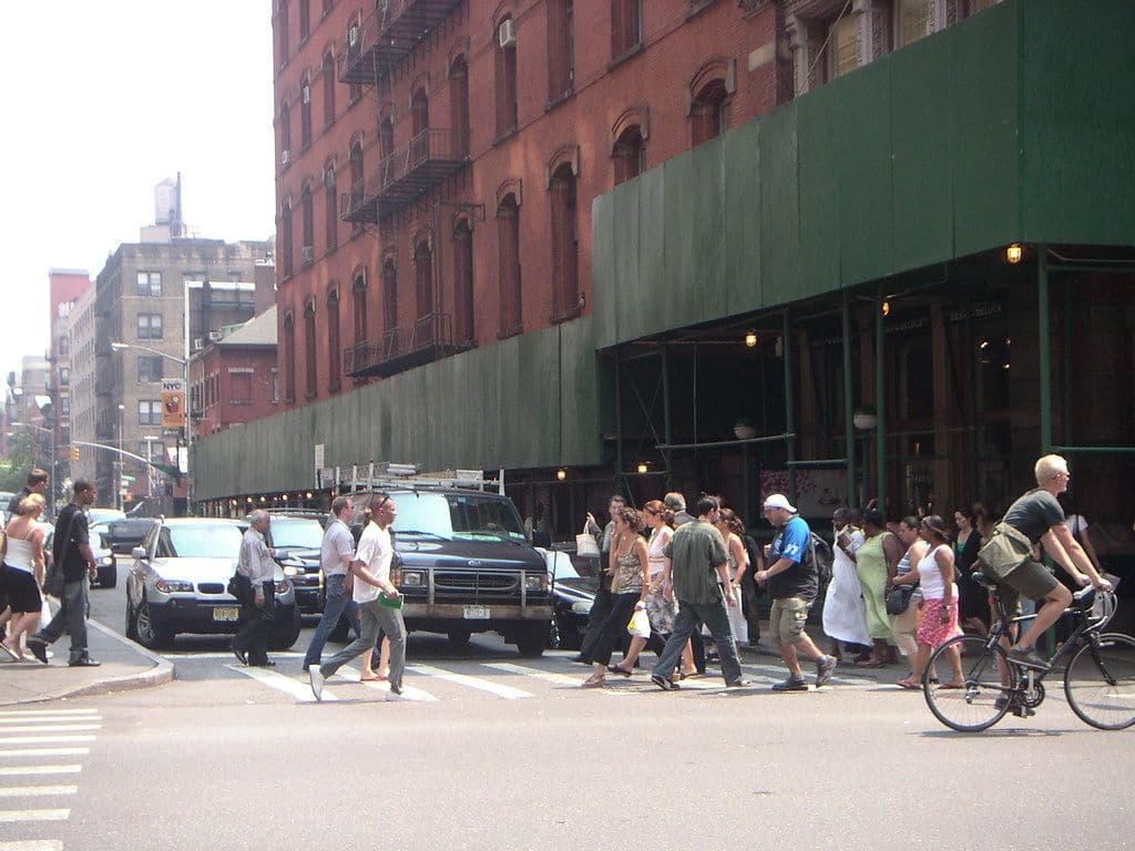 City street with pedestrians, cyclists and cars