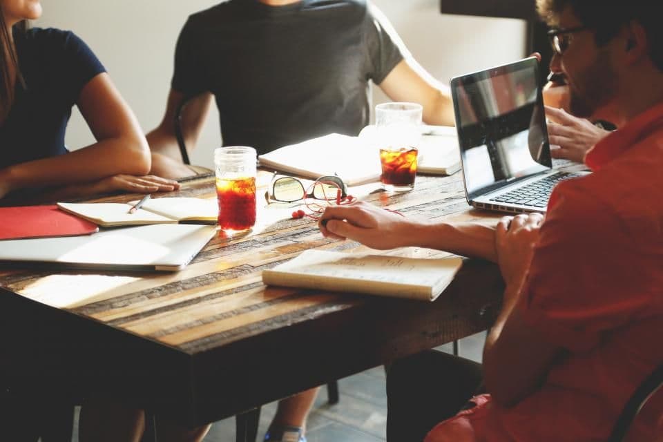 Team working together around a table